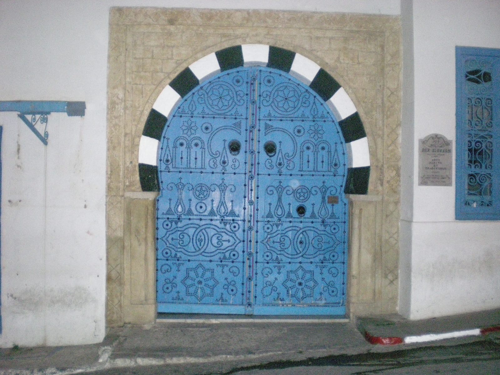 The studded blue entrance door of the museum house