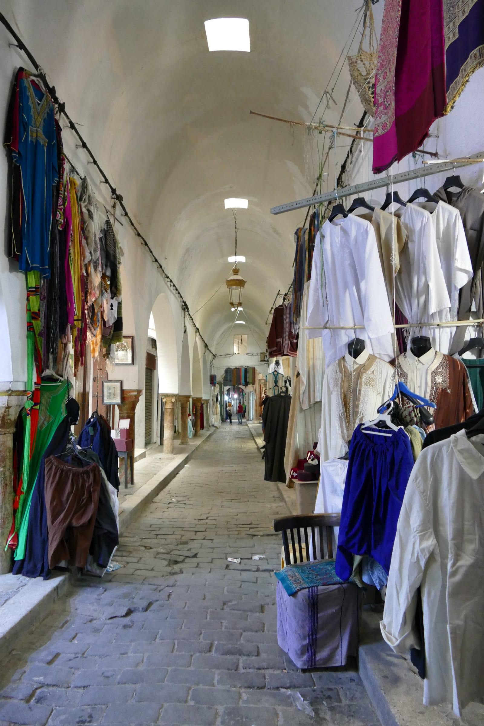 Clothing stalls in a covered souk in the medina of Tunis