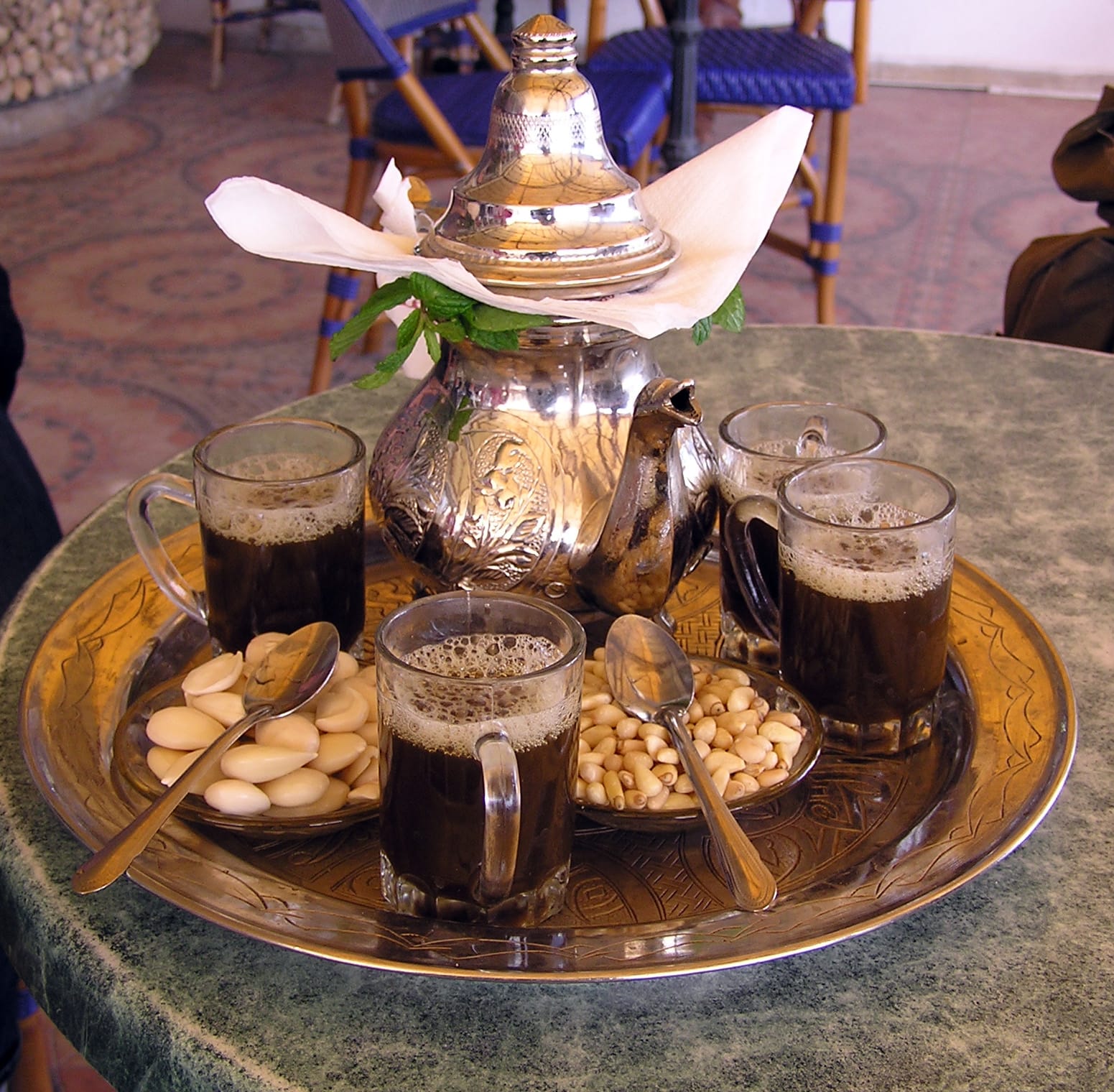 Tunisian mint tea with pine nuts on a brass tray